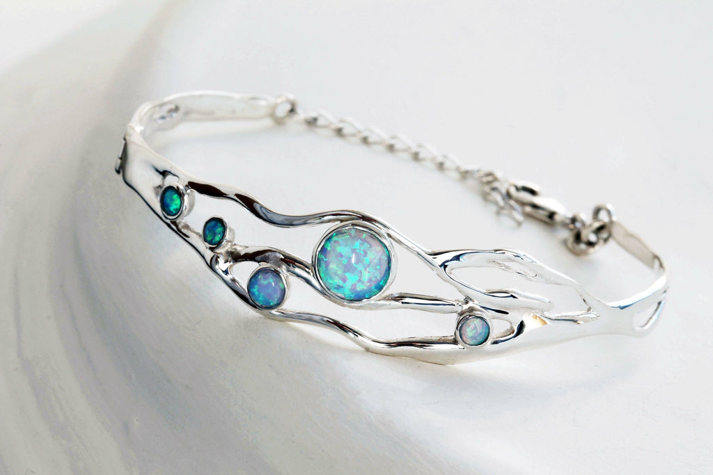 Ba1831 organic silver bangle with five blue opals